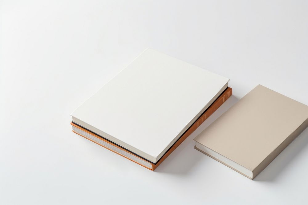 Books on desk with stationary publication diary white background. AI generated Image by rawpixel.