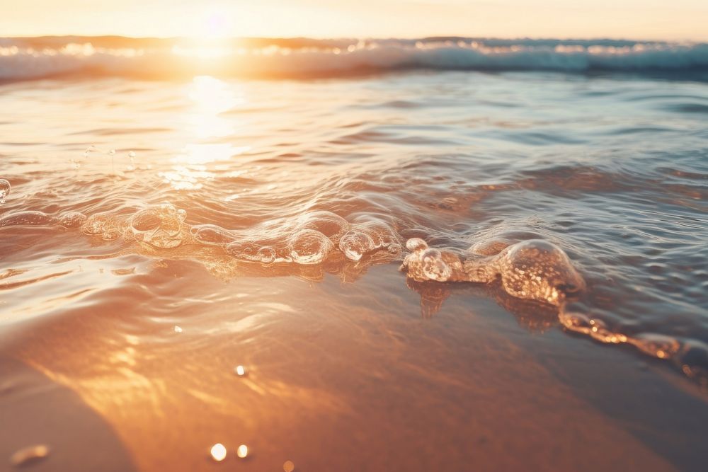 The water is reflecting the sunlight on the sand outdoors horizon nature. AI generated Image by rawpixel.