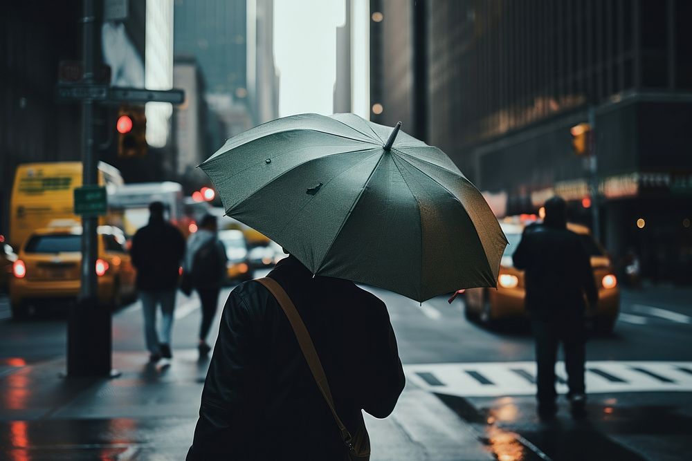A person with a backpack and an umbrella at New York adult rain car. AI generated Image by rawpixel.