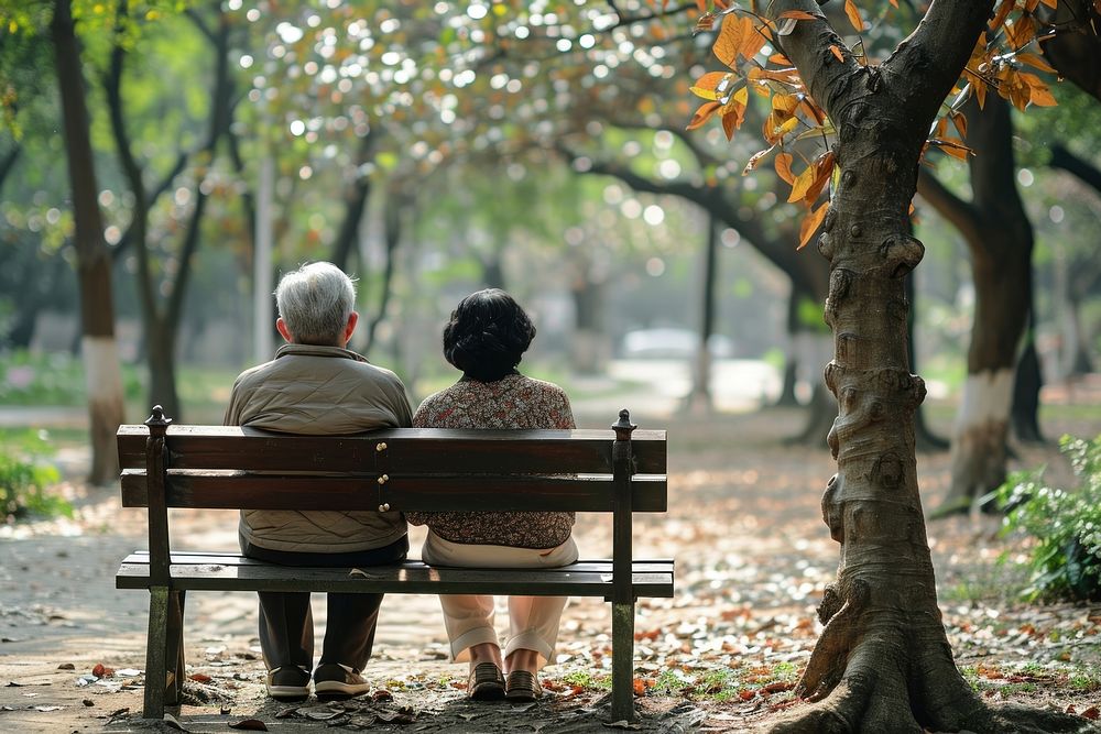 Senior taiwanese couple sitting bench park. AI generated Image by rawpixel.