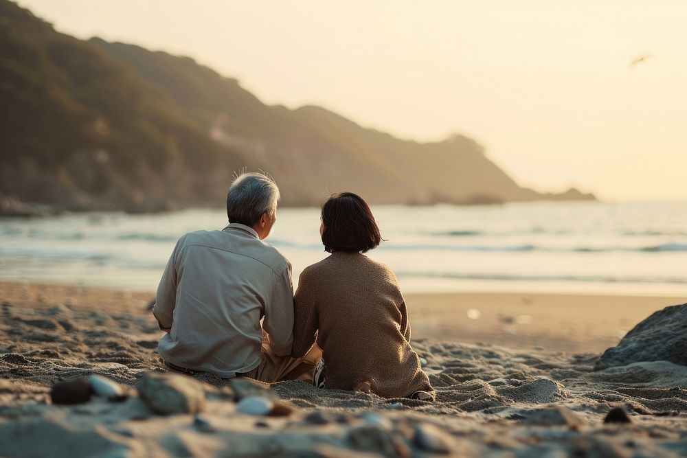 Senior korean couple beach outdoors vacation. AI generated Image by rawpixel.