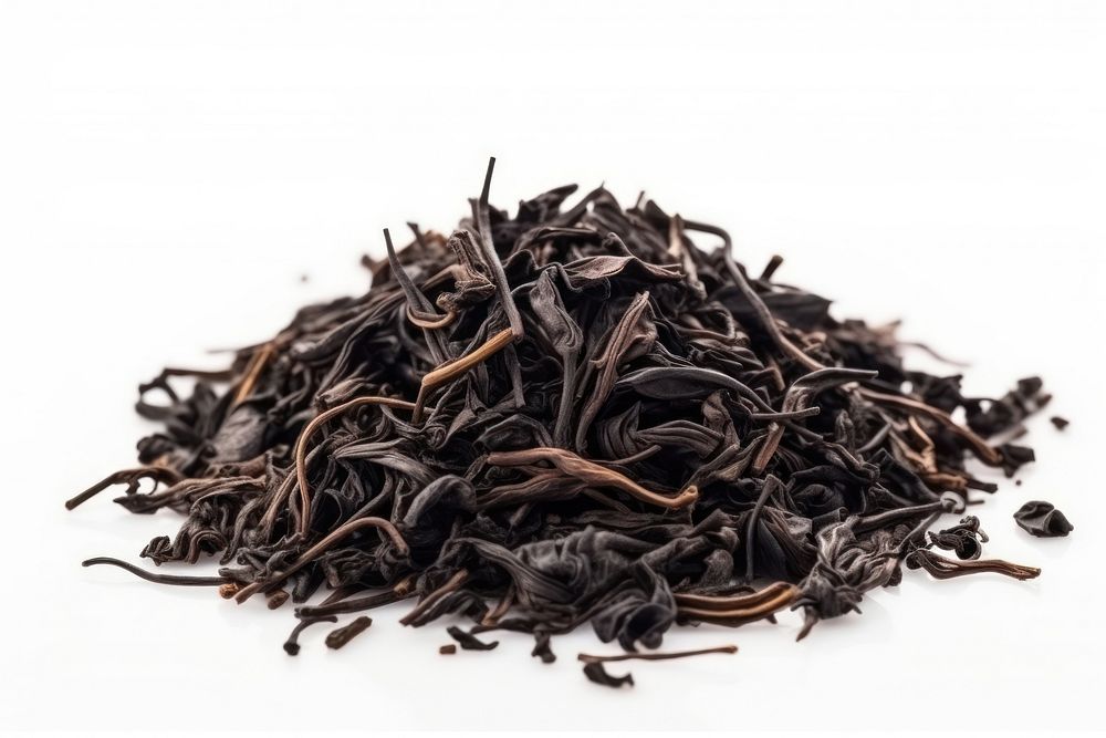 Black tea leaves pile spice black food. AI generated Image by rawpixel.