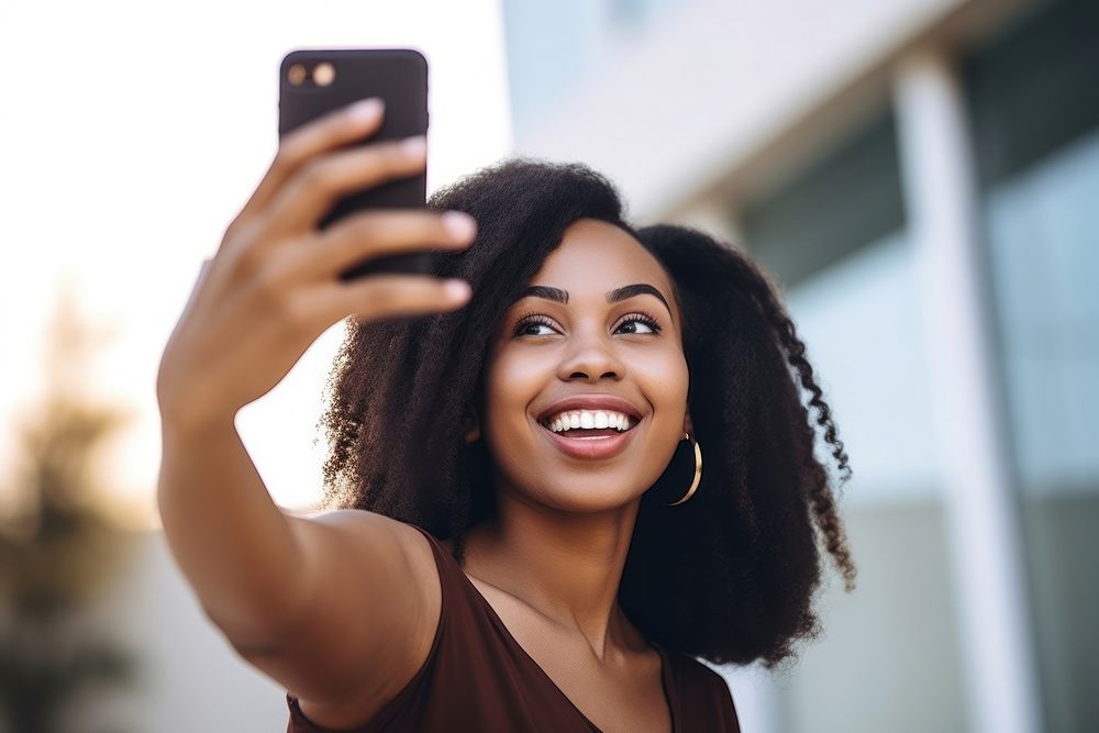 Black Woman taking a selfie with smartphone smile adult woman. AI generated Image by rawpixel.