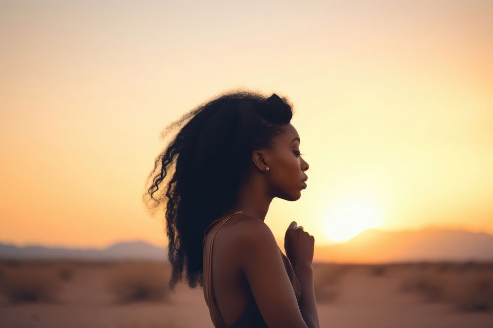 Black young woman watching sunset at desert outdoors nature travel. AI generated Image by rawpixel.