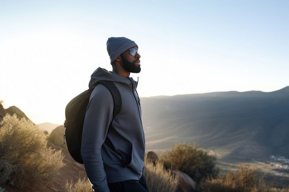 Black Man on early morning hike up mountainside recreation adventure backpack. AI generated Image by rawpixel.