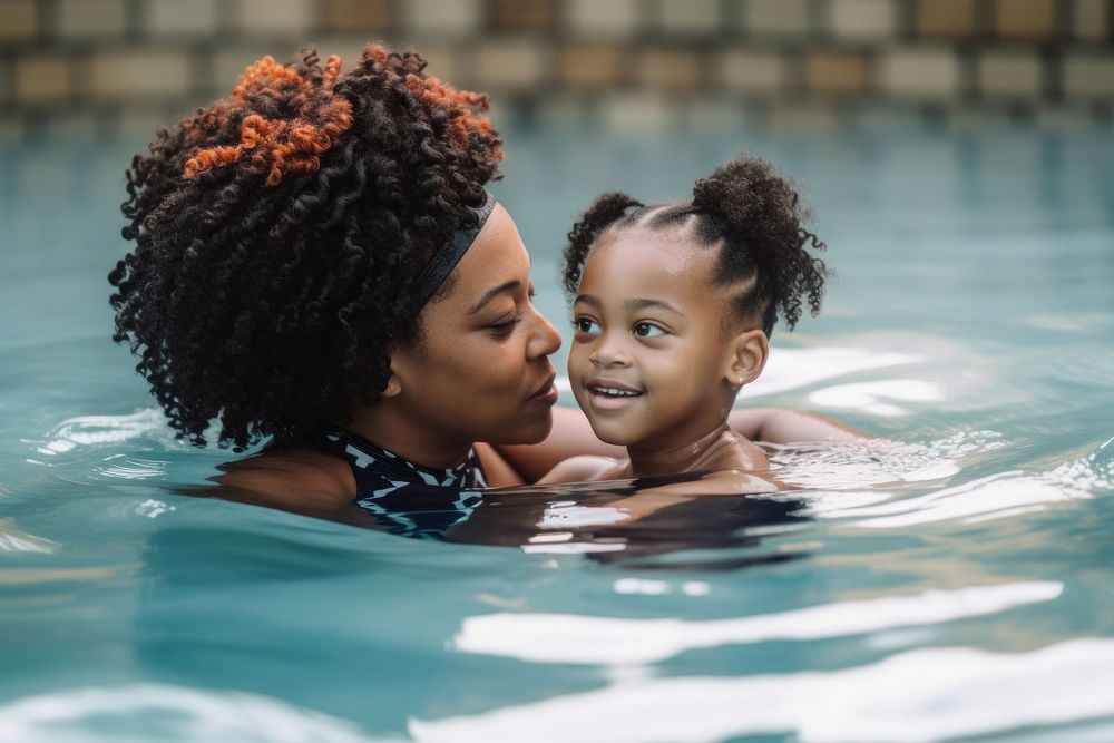 Black mother and daughter swimming together bathing travel adult. AI generated Image by rawpixel.