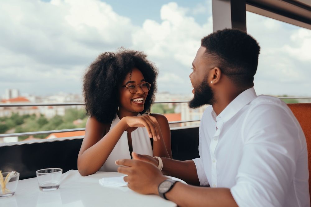 Black smiling couple dining at rooftop restaurant travel adult togetherness. AI generated Image by rawpixel.