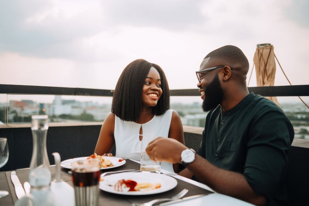 Black smiling couple dining at rooftop restaurant travel adult food. AI generated Image by rawpixel.
