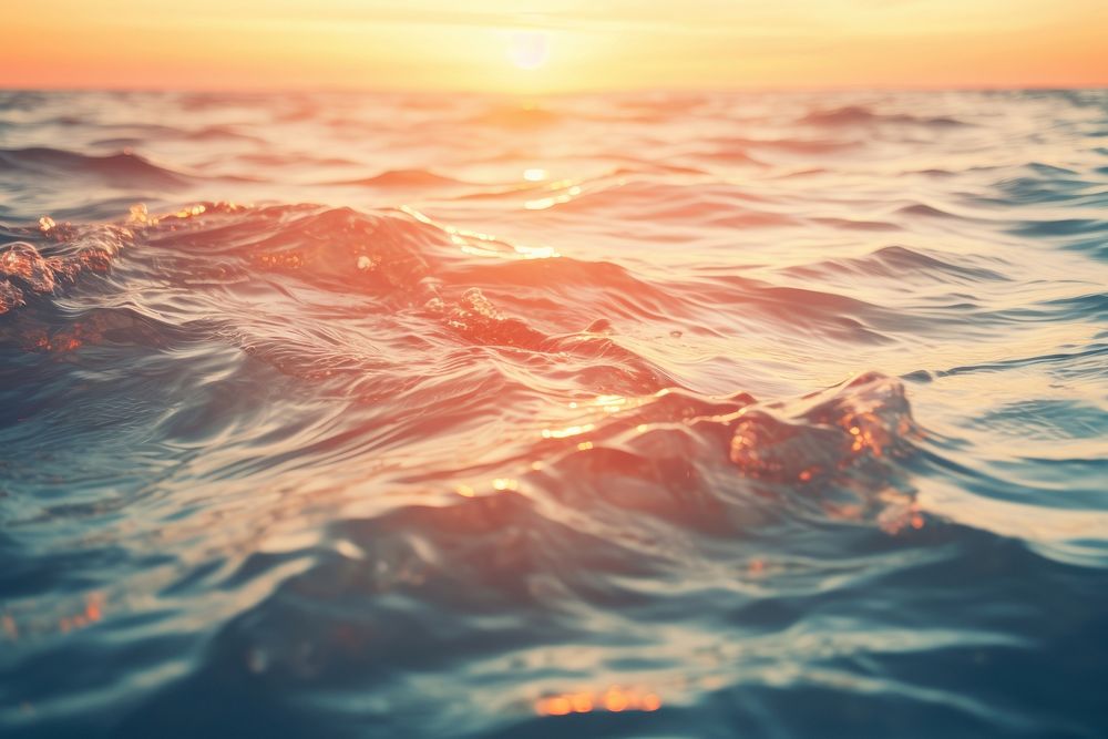 Blurred texture of ocean water at sunset outdoors horizon nature. AI generated Image by rawpixel.