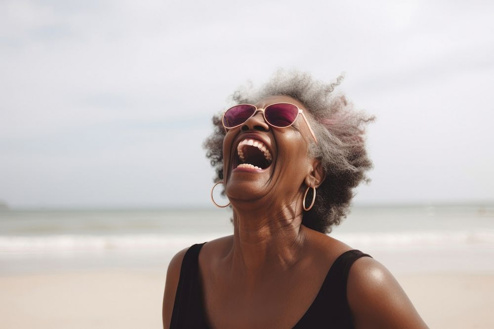 Cheerful black senior woman screaming at beach laughing glasses travel. AI generated Image by rawpixel.