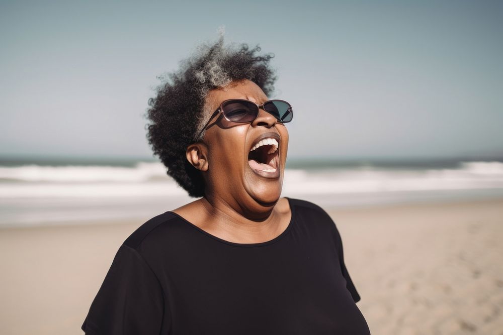 Cheerful black senior woman screaming at beach laughing travel sunglasses. AI generated Image by rawpixel.