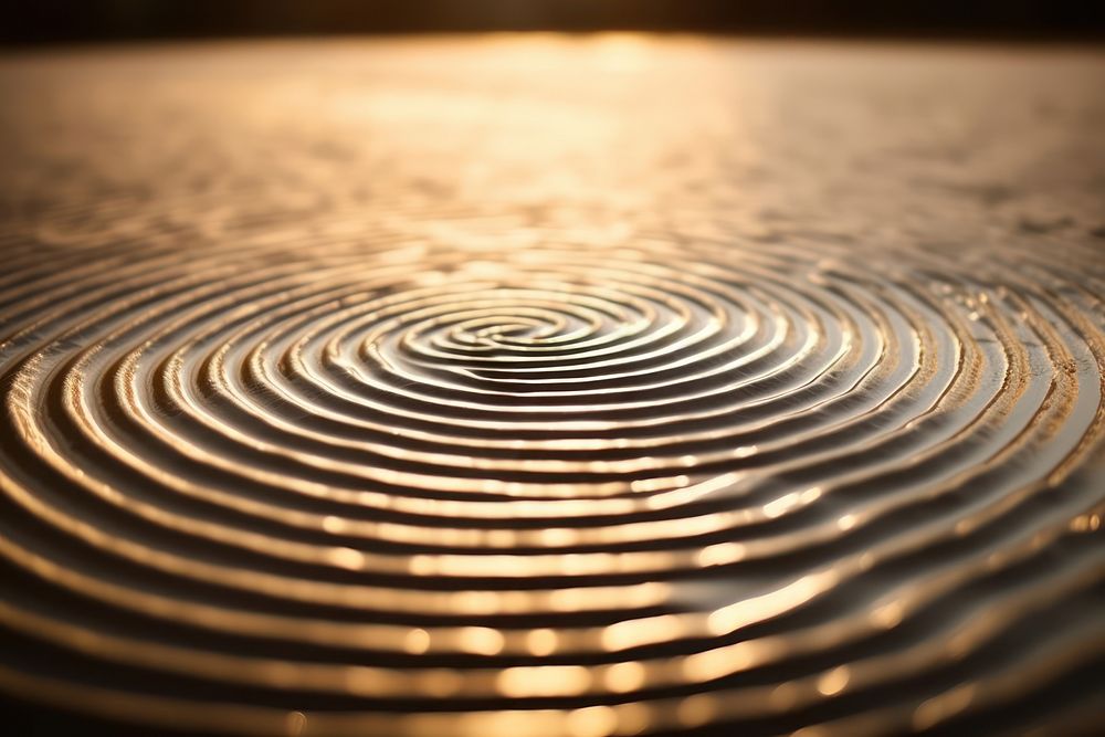 Close-up of ripples in the sand outdoors spiral light. AI generated Image by rawpixel.