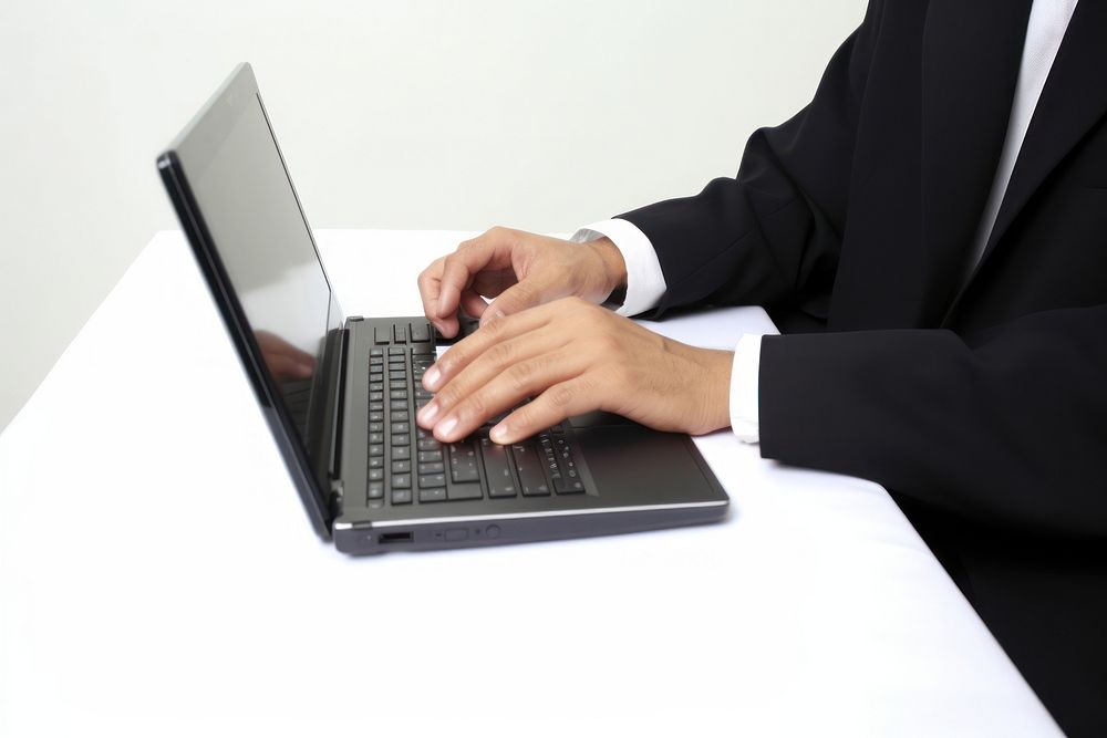 East Asian Businessman typing and replying email by a laptop computer adult businesswear. AI generated Image by rawpixel.
