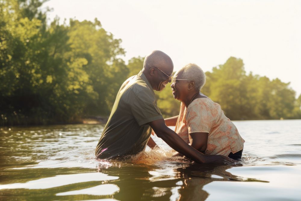 Elderly black Couple Messing About at Waters Edge outdoors travel nature. AI generated Image by rawpixel.