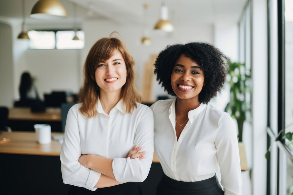 Happy multiethnic smiling business women working together in office adult smile happy. AI generated Image by rawpixel.