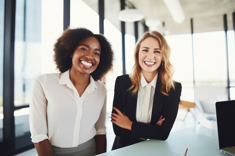 Happy multiethnic smiling business women working together in office laughing adult smile. AI generated Image by rawpixel.