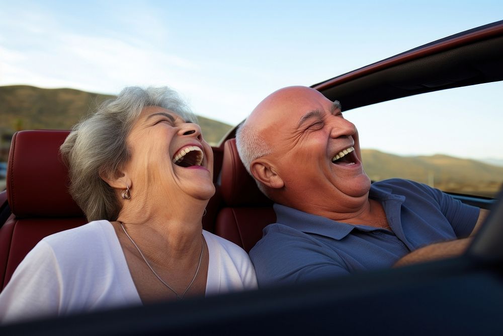 Hispanic Older couple laughing in convertible adult togetherness accessories. AI generated Image by rawpixel.