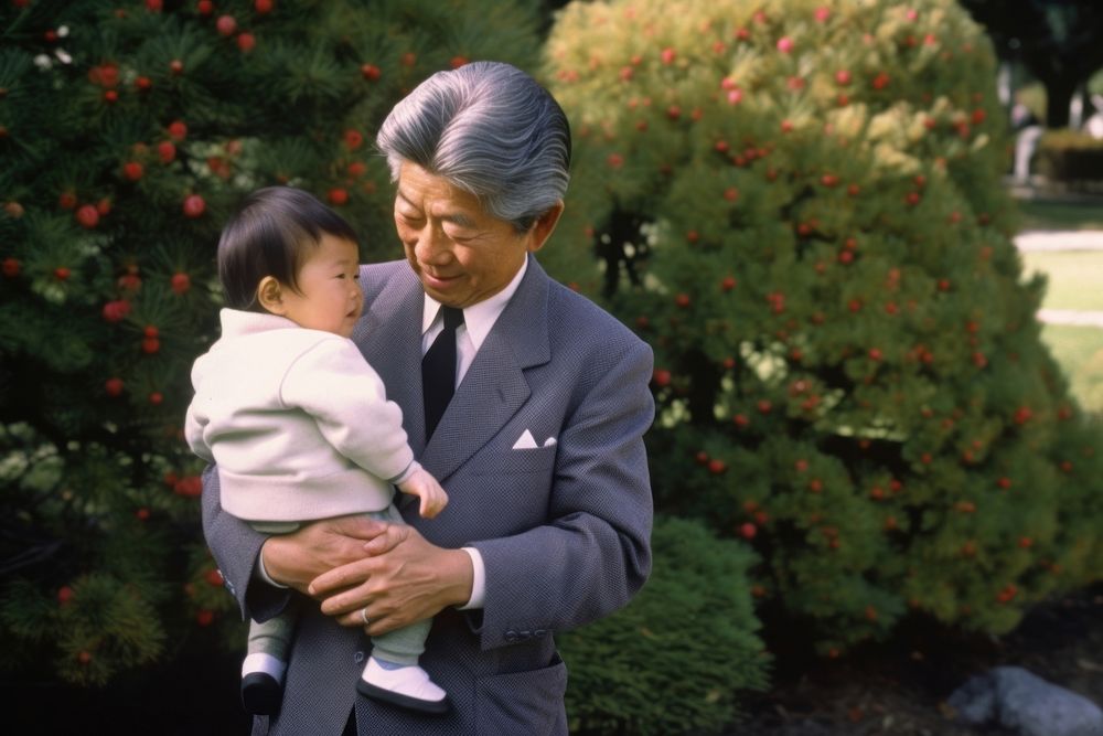 Japanese father holding his cute baby portrait outdoors people. AI generated Image by rawpixel.