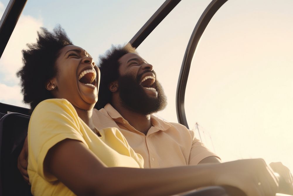 Laughing and screaming black couple riding roller coaster at amusement park travel togetherness friendship. AI generated…