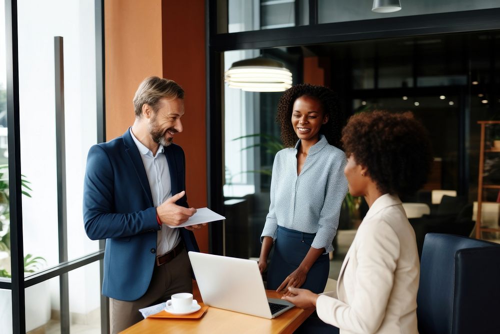 Multi-ethnic coworkers discussing in office conversation computer laptop. AI generated Image by rawpixel.