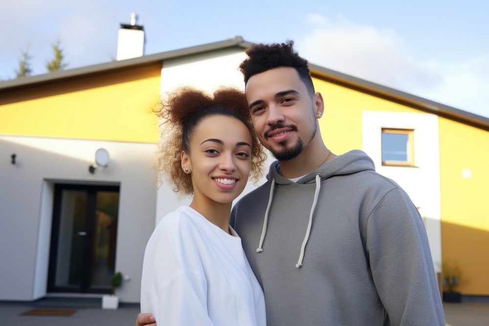 Portrait of young couple in front of new home portrait adult photo. AI generated Image by rawpixel.