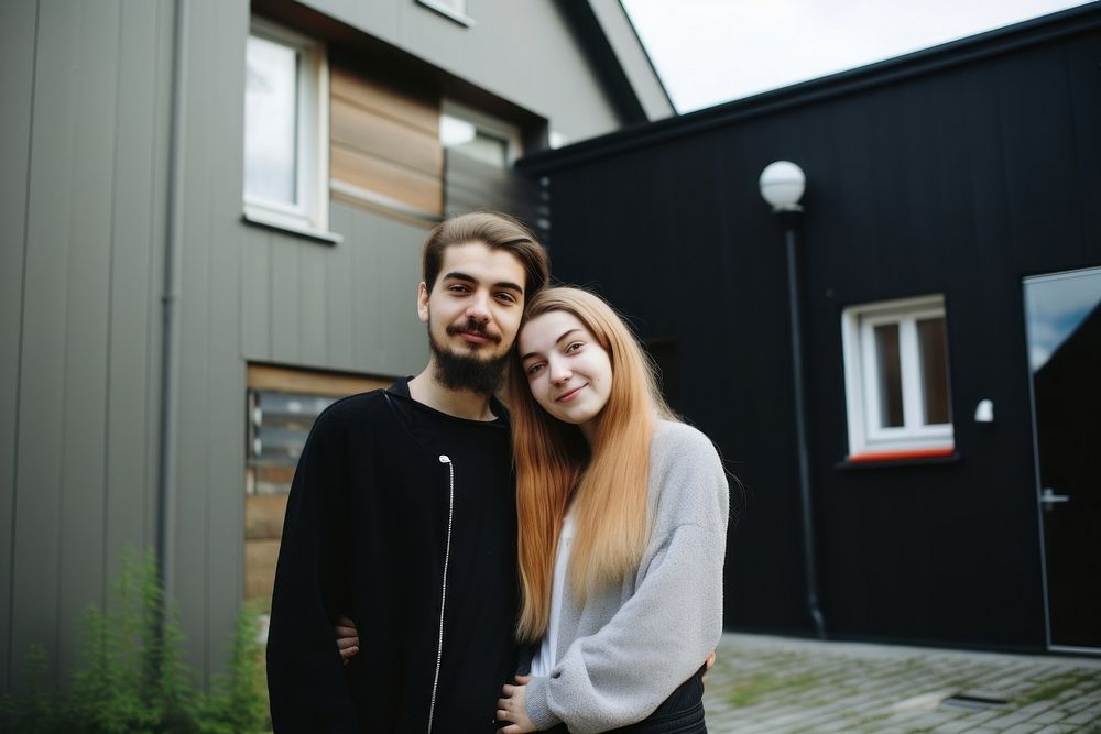 Portrait of young couple in front of new home portrait adult photo. AI generated Image by rawpixel.