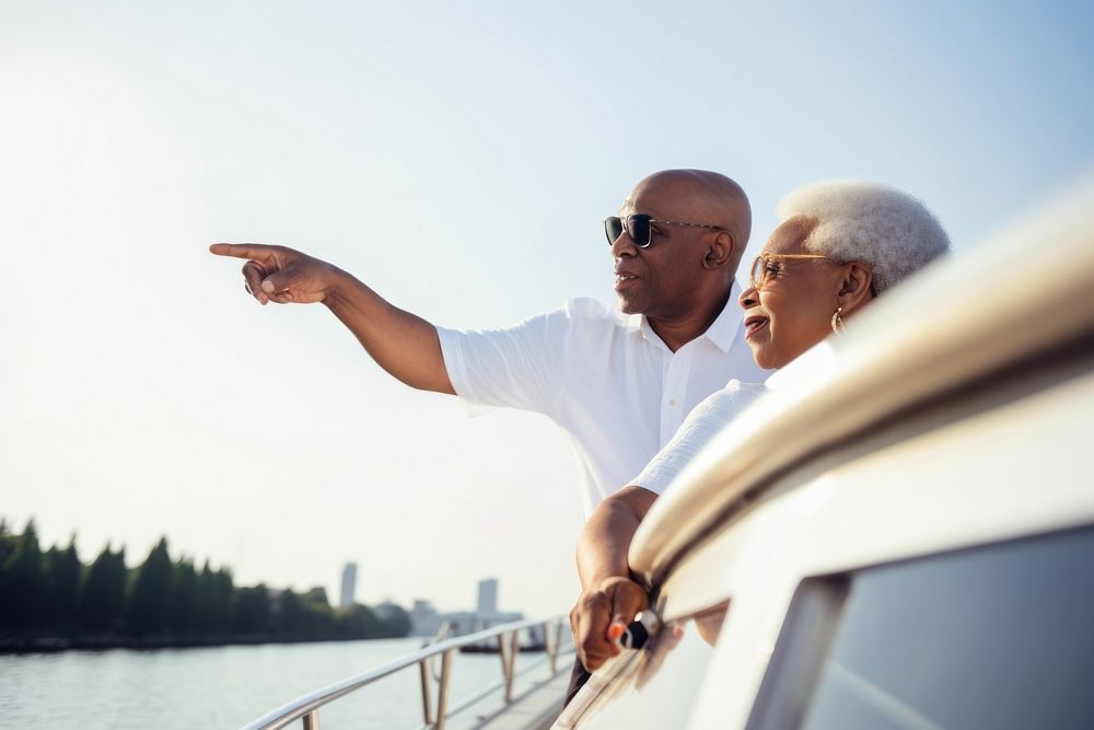 Senior black Couple Standing on Deck on a Boat Looking at the View standing glasses looking. AI generated Image by rawpixel.