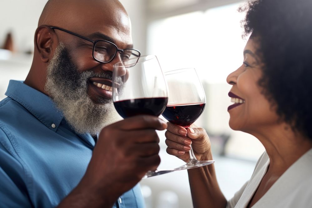 Senior black man toasting wineglass with mature woman glasses adult togetherness. AI generated Image by rawpixel.