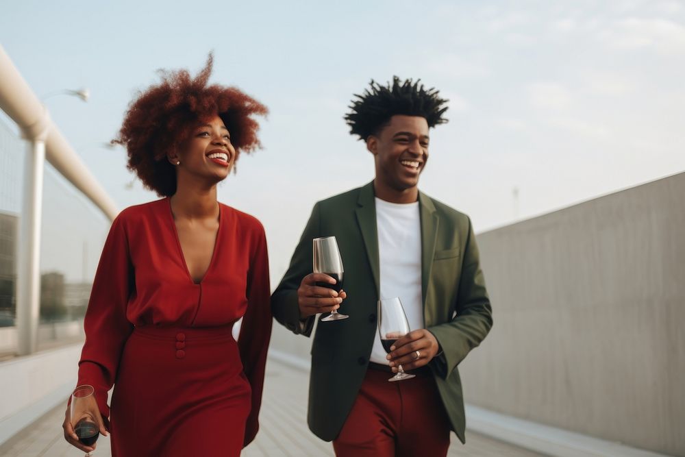 Smiling heterosexual black couple walking with red wine laughing adult togetherness. AI generated Image by rawpixel.