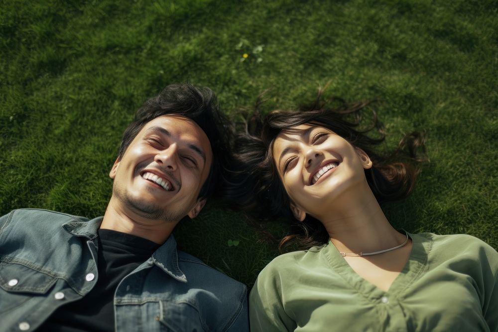 Happy latinx couple grass laughing portrait. AI generated Image by rawpixel.