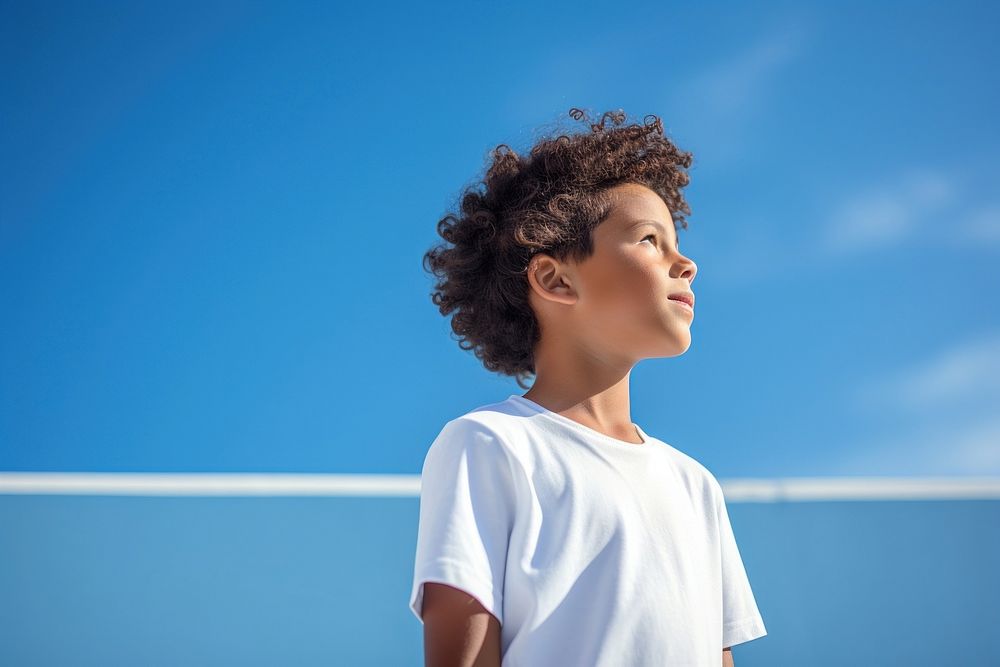 Mixed race indian kid white blue contemplation. AI generated Image by rawpixel.