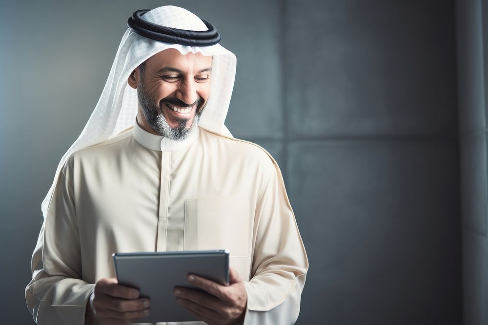 Arab businessman computer smiling looking. AI generated Image by rawpixel.
