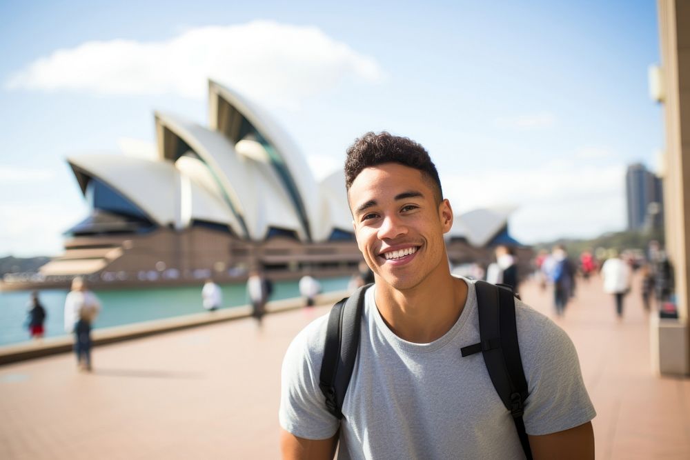A college student mixed race man outdoors architecture happiness. AI generated Image by rawpixel.