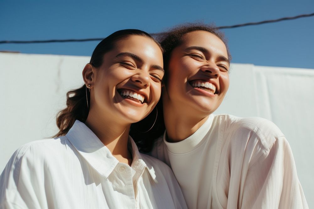 Latinx lesbian couple smile laughing adult. AI generated Image by rawpixel.