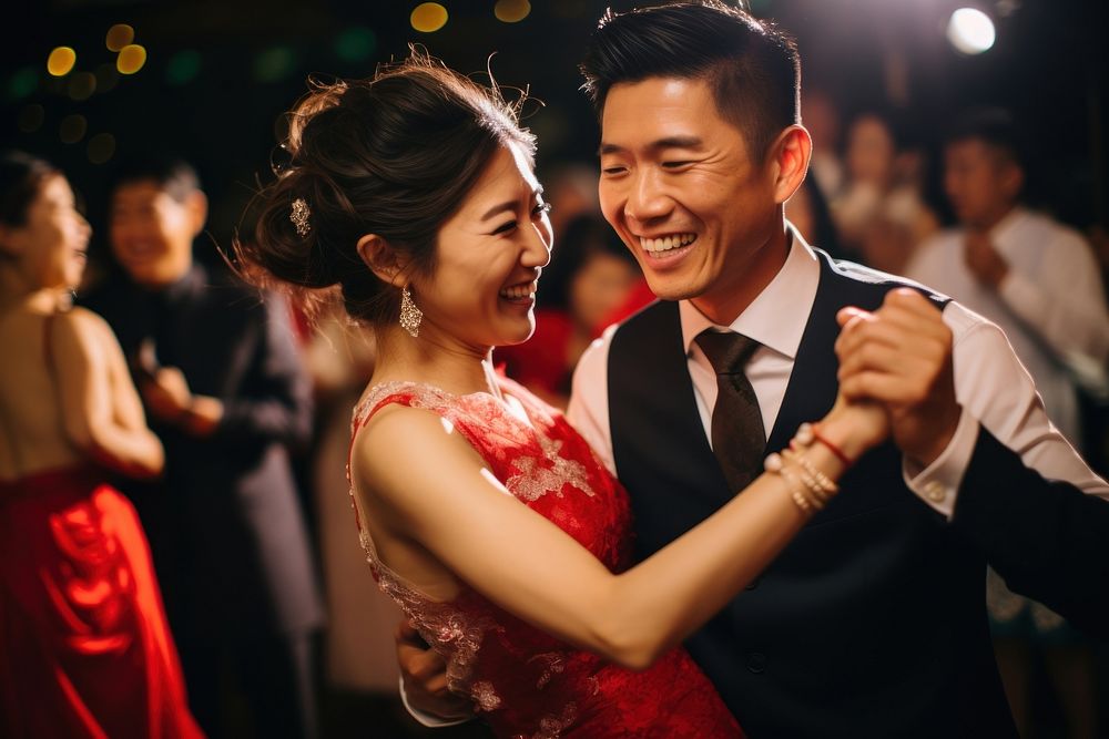 East asian couple dancing in the party celebration laughing wedding. AI generated Image by rawpixel.