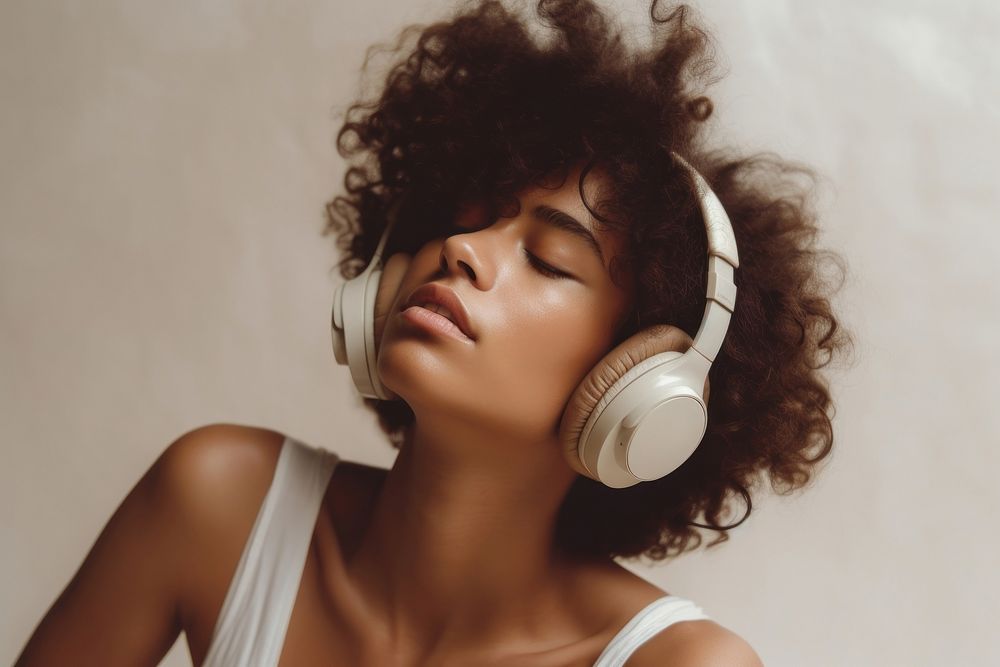 Mixed race woman headphones portrait headset. AI generated Image by rawpixel.