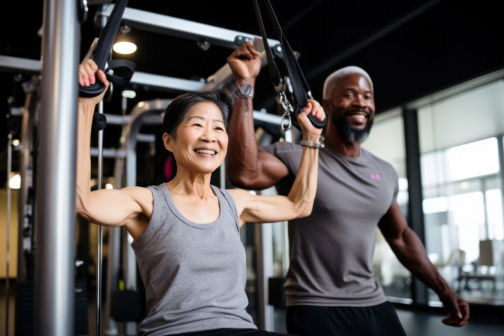 Asian senior woman doing lat pulldowns exercise sports adult male. AI generated Image by rawpixel.