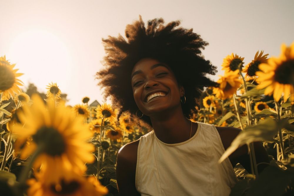 Black girl sunflower portrait laughing. AI generated Image by rawpixel.