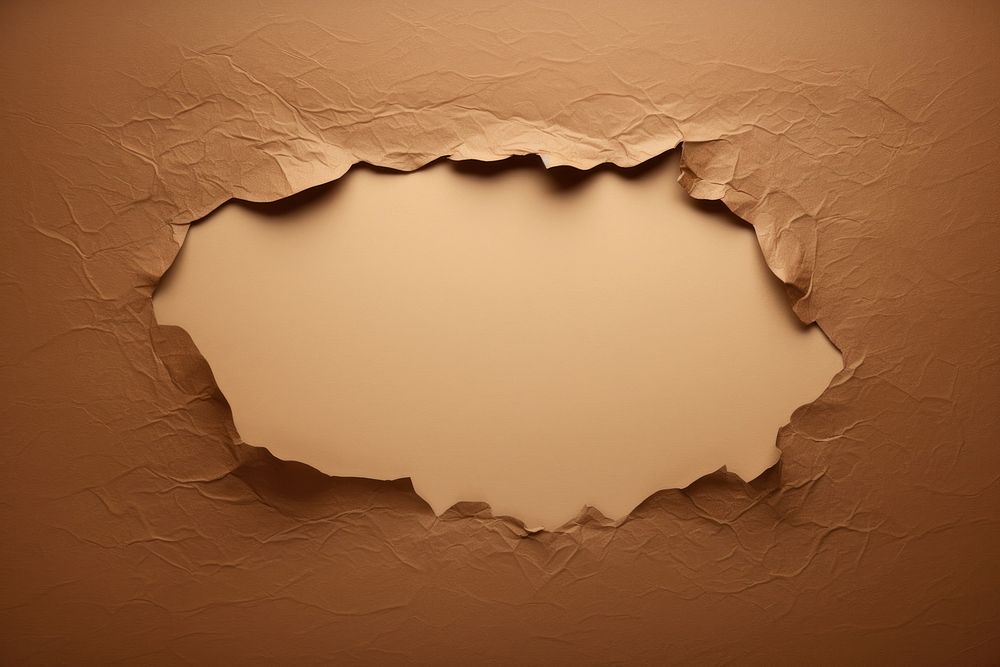 Kraft paper backgrounds brown hole. AI generated Image by rawpixel.