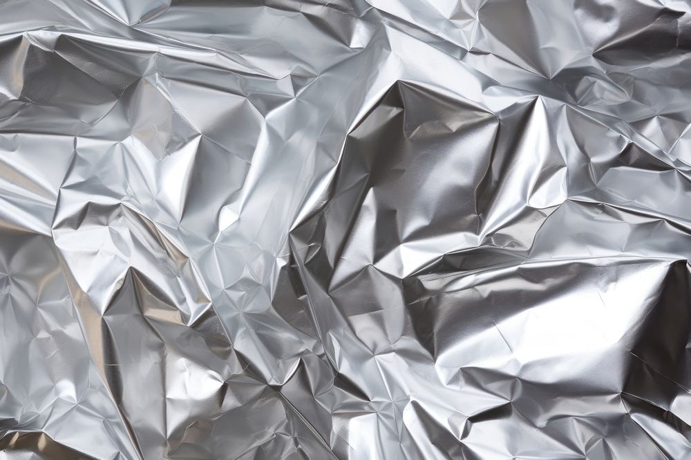 Crumpled aluminum foil texture backgrounds crumpled aluminium. AI generated Image by rawpixel.