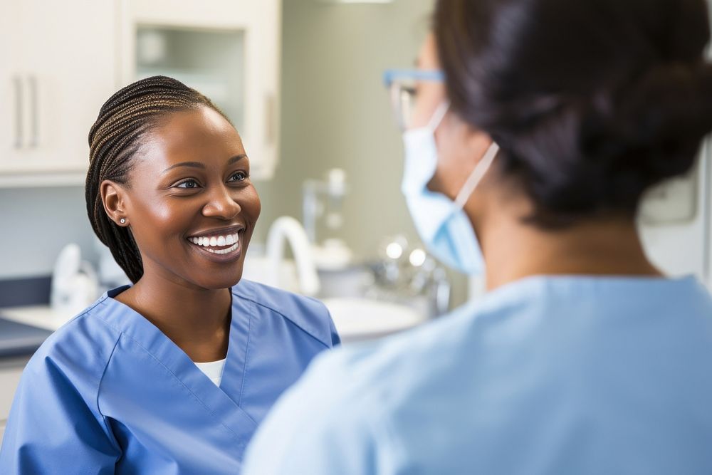 Photo of a dental nurse in light blue scrubs patient talking adult. AI generated Image by rawpixel.