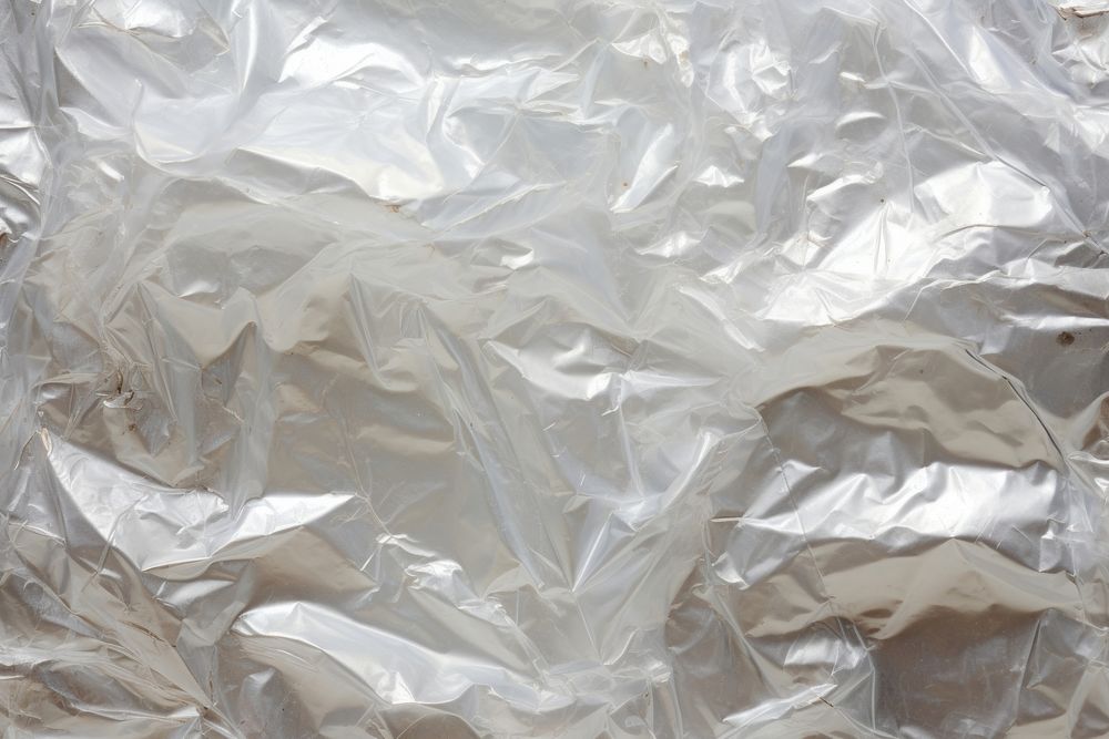 Plastic wrap texture backgrounds aluminium crumpled. AI generated Image by rawpixel.