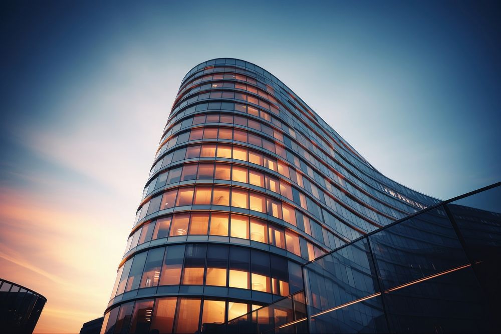 Curved modern office building architecture sunset tower. AI generated Image by rawpixel.