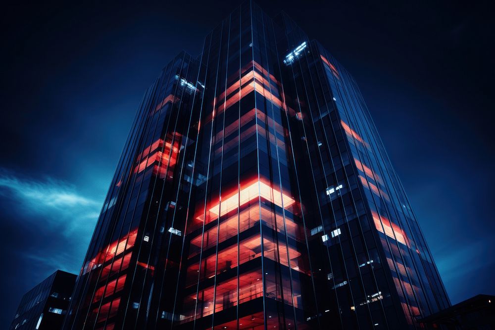 Modern skyscraper architecture illuminated cityscape. AI generated Image by rawpixel.