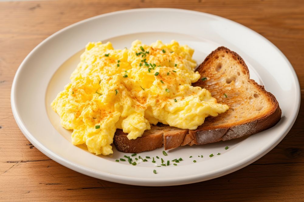 Sourdough toast scrambled eggs plate food. 