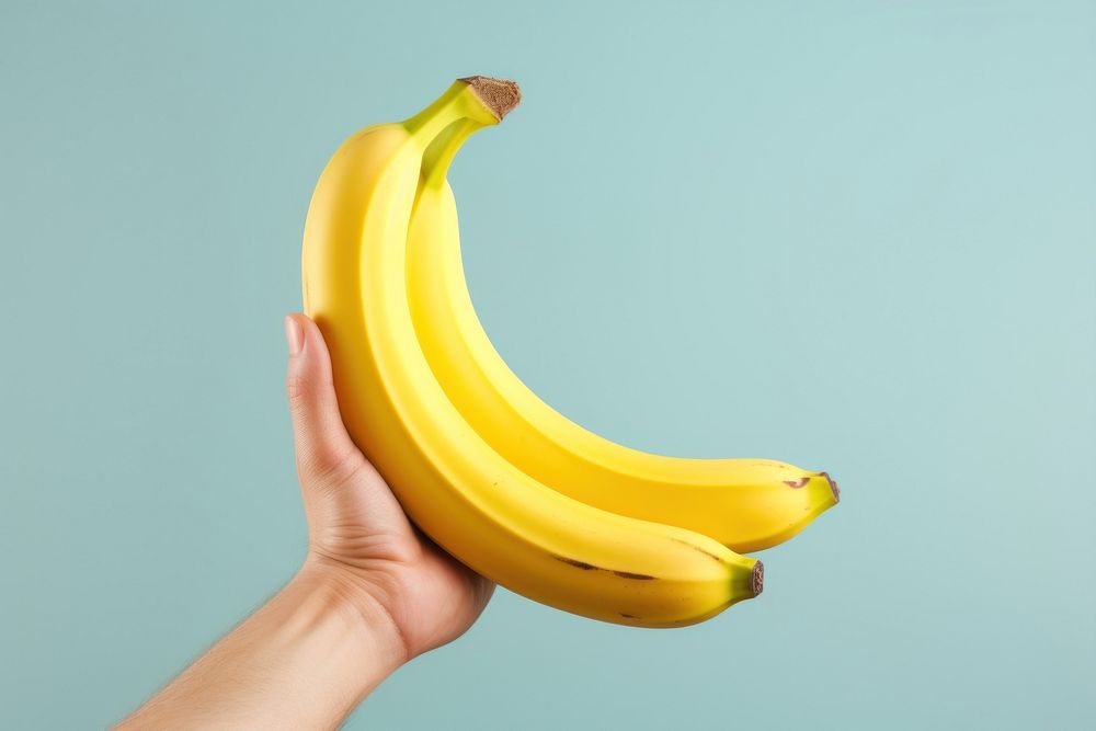 Banana holding fruit plant. AI generated Image by rawpixel.
