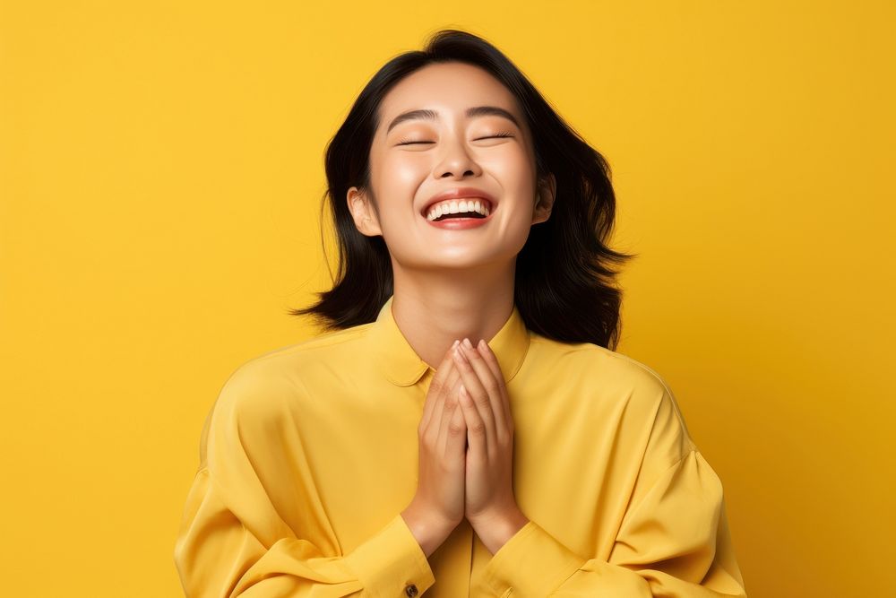 Asian laughing yellow smile. AI generated Image by rawpixel.