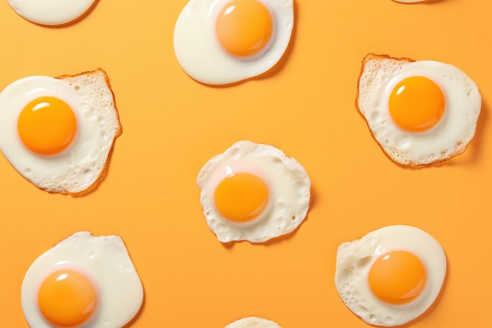 Fried eggs pattern food breakfast. AI generated Image by rawpixel.