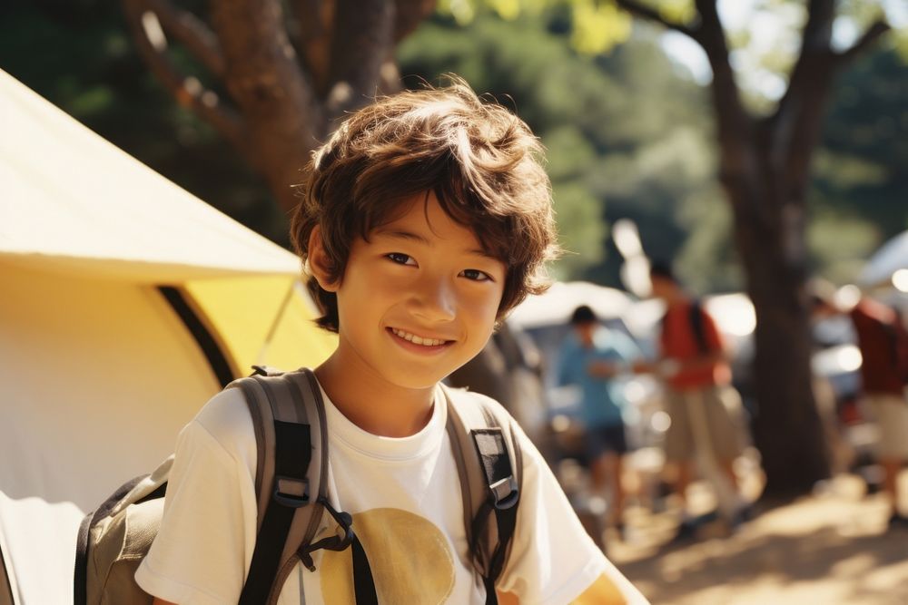 Japanese kid camping outdoors smile. AI generated Image by rawpixel.