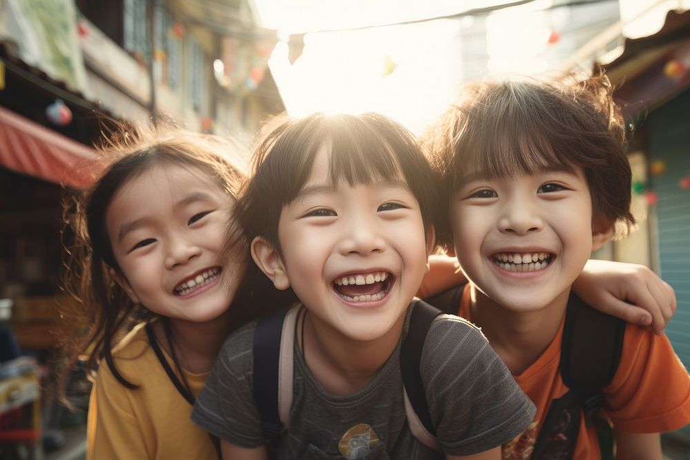 Taiwanese kids laughing portrait child. AI generated Image by rawpixel.